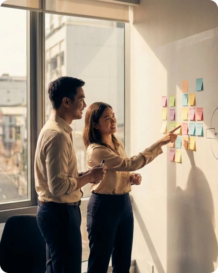 Two Content Hacker strategists at a whiteboard